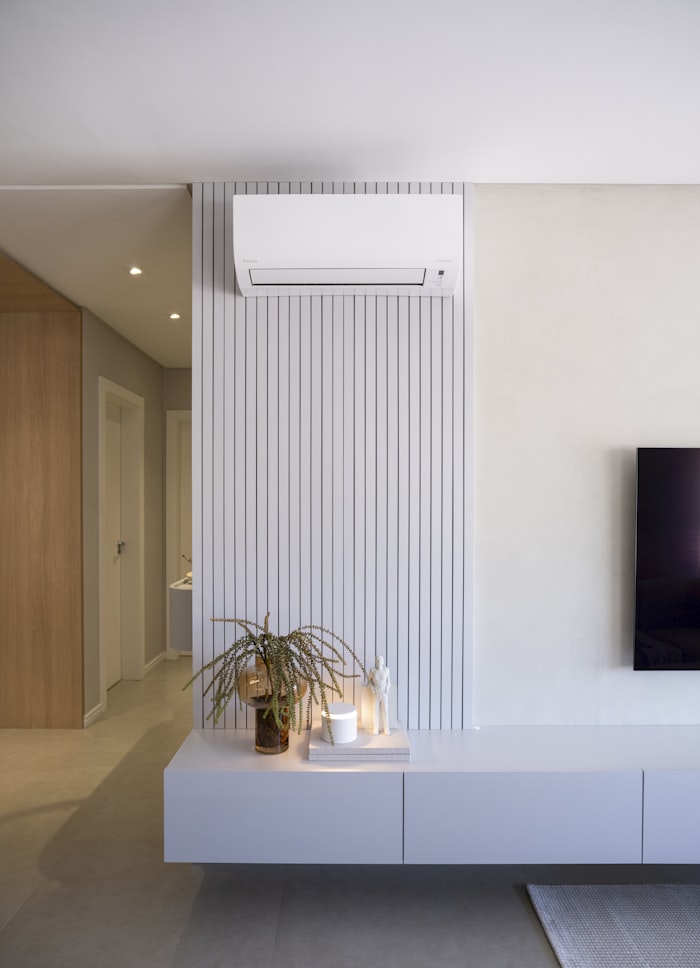 Wall-mounted split air conditioner in a living room