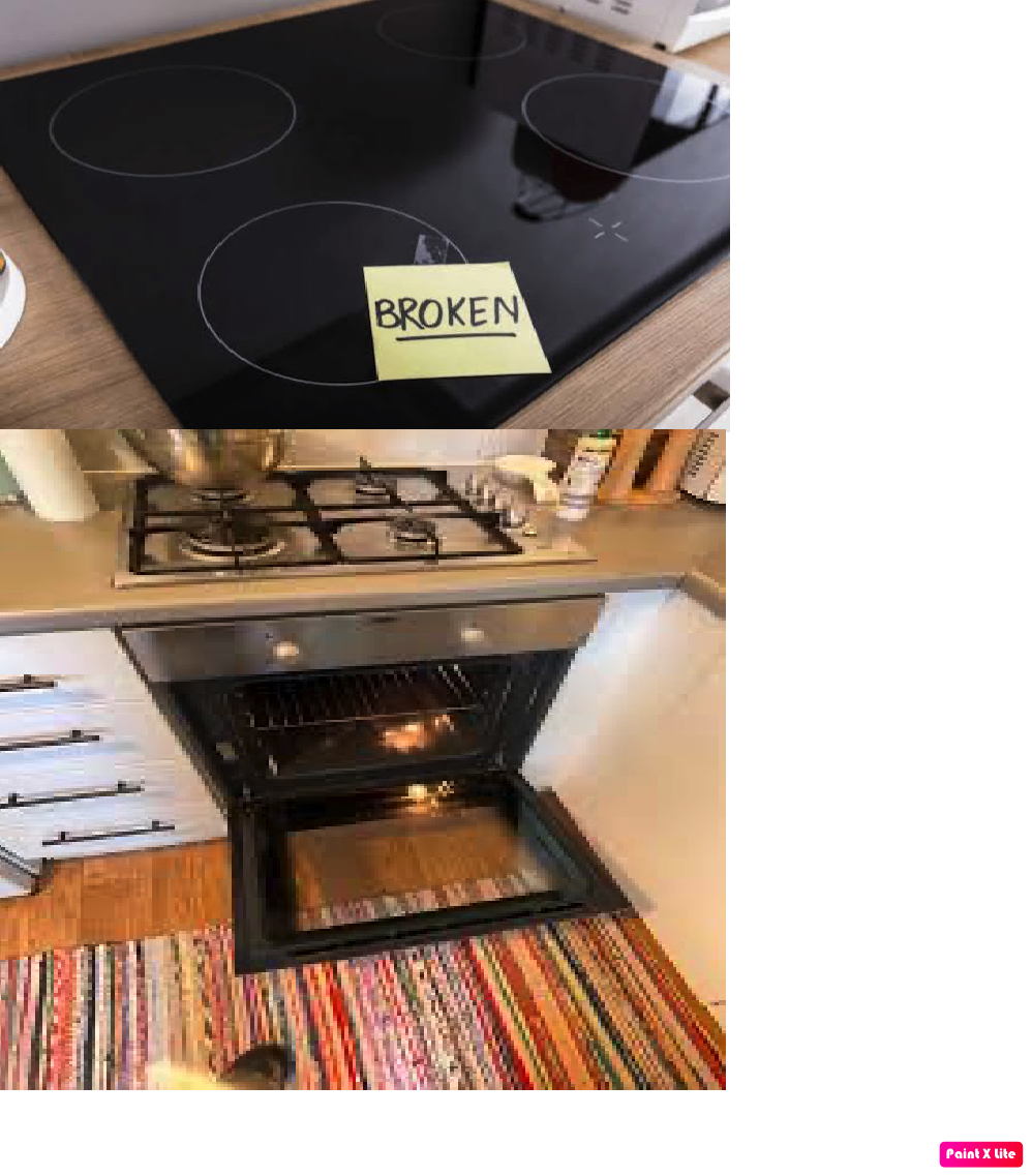 Stainless steel cooking range with oven in a home kitchen